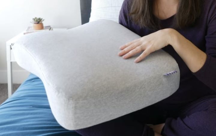  Checking how soft the fabric of the pillow for neck arthritis