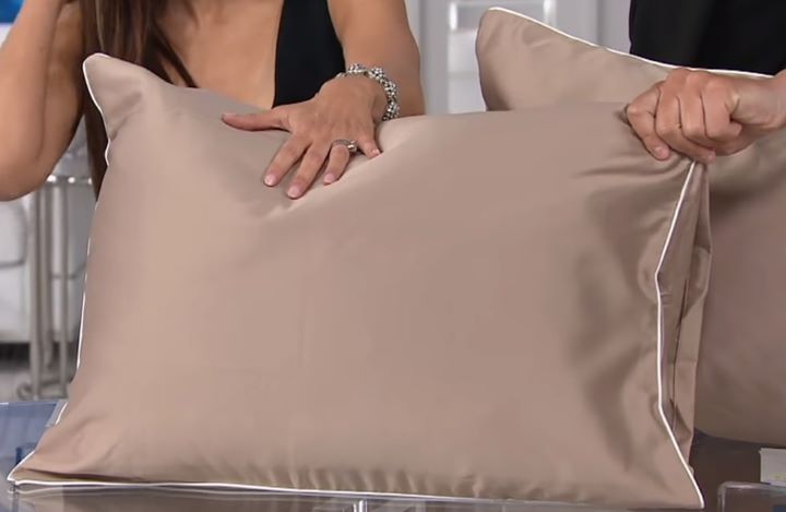 Checking how smooth and comfortable the copper-infused pillow and pillowcase